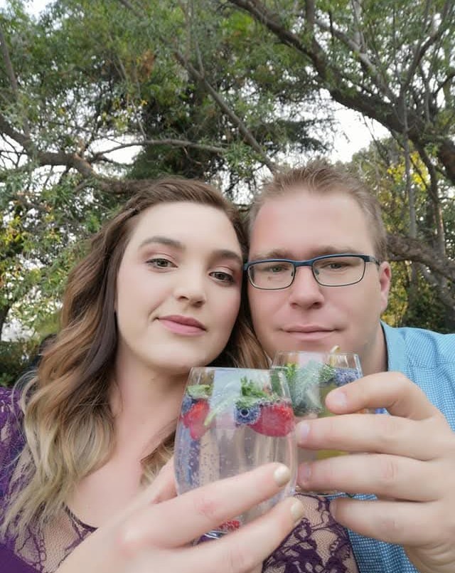 The couple behind The Wedding Web Co. celebrating with a toast