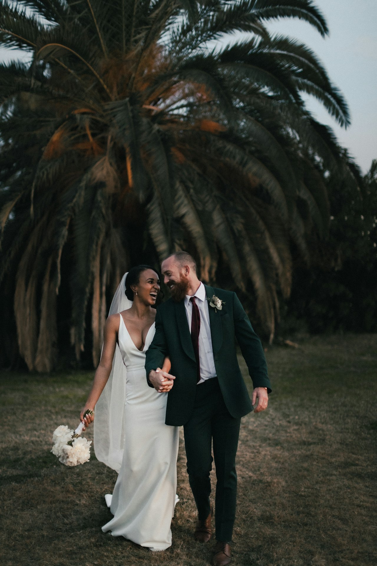 Couple embracing during their wedding celebration